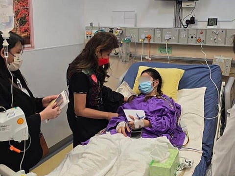 Philippine Senator Imee Marcos visited Rhodora Alcaraz in the hospital.