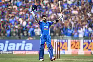 India's Virat Kohli celebrates after scoring a century during the second one-day international (ODI) cricket match against South Africa at the Shaheed Veer Narayan Singh International Cricket Stadium in Raipur on December 3, 2025.