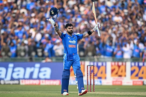 India's Virat Kohli celebrates after scoring a century during the second one-day international (ODI) cricket match against South Africa at the Shaheed Veer Narayan Singh International Cricket Stadium in Raipur on December 3, 2025.