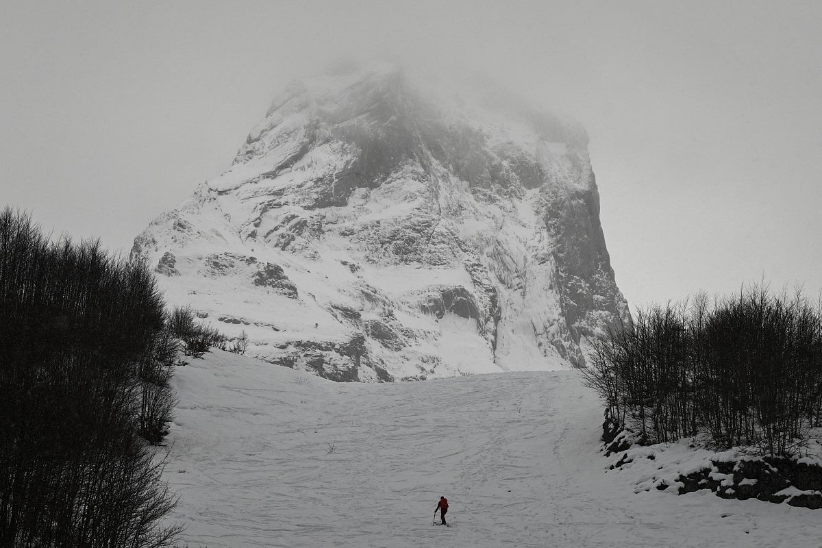 A cross-country skier ascends a trail at the Gourette ski resort near the Col d'Aubisque pass in the Pyrenees, south-western France on December 3, 2025.