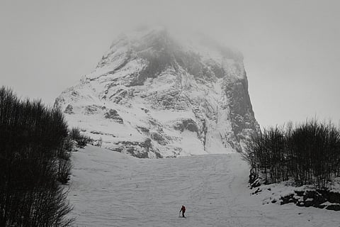 A cross-country skier ascends a trail at the Gourette ski resort near the Col d'Aubisque pass in the Pyrenees, south-western France on December 3, 2025.