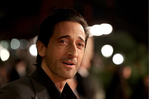 US actor Adrien Brody arrives for the opening ceremony of the 5th edition of the Red Sea Film Festival in Jeddah on December 4, 2025.