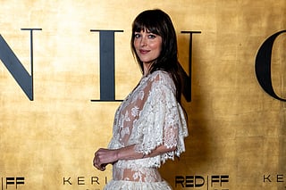 US actress Dakota Johnson arrives for the "Women In Cinema" gala dinner, as part of the fifth edition of the Red Sea Film Festival, in Jeddah on December 5, 2025.