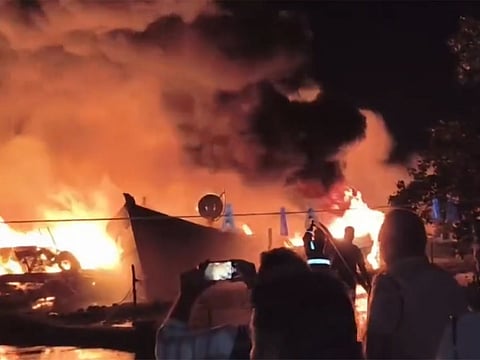 Gas cylinders stored on the boats exploded soon after the fire started.