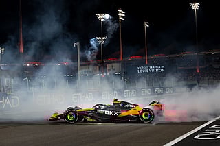 McLaren's Lando Norris performing donuts after winning his first Formula 1 drivers' championship at the Formula 1 Etihad Airways Abu Dhabi Grand Prix 2025.