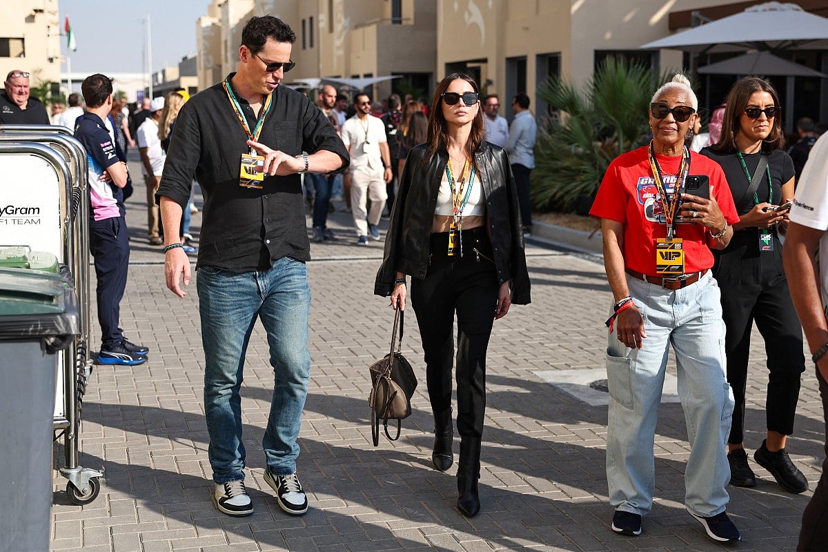 Cuban actress Ana de Armas (C) walks in the paddock ahead of the Abu Dhabi Formula One Grand Prix at the Yas Marina Circuit in Abu Dhabi on December 7, 2025.