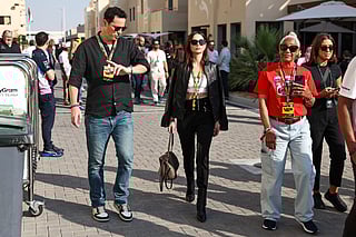 Cuban actress Ana de Armas (C) walks in the paddock ahead of the Abu Dhabi Formula One Grand Prix at the Yas Marina Circuit in Abu Dhabi on December 7, 2025.