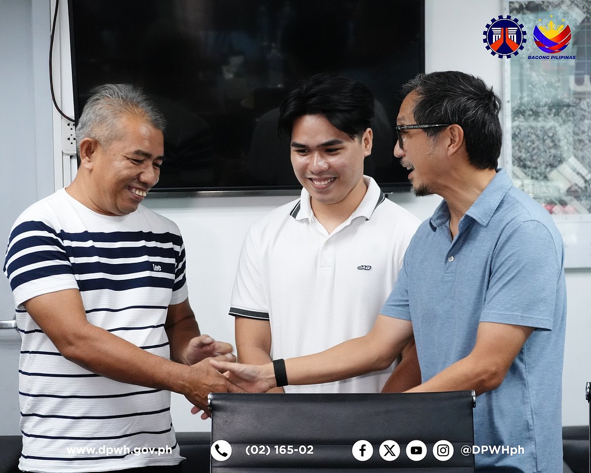 Department of Public Works and Highways (DPWH) Secretary Vince Dizon (right) meets with the newly-hired civil engineer Dave Rusty Recososa (center) and his father Edwin (left) at the DPWH Davao Regional Office.