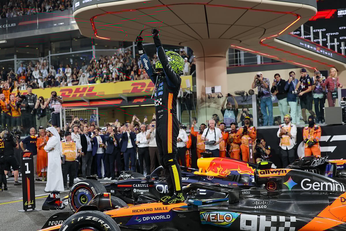 McLaren's Lando Norris celebrates after winning his first Formula 1 drivers' championship with Abu Dhabi winner at the Formula 1 Etihad Airways Abu Dhabi Grand Prix 2025. 