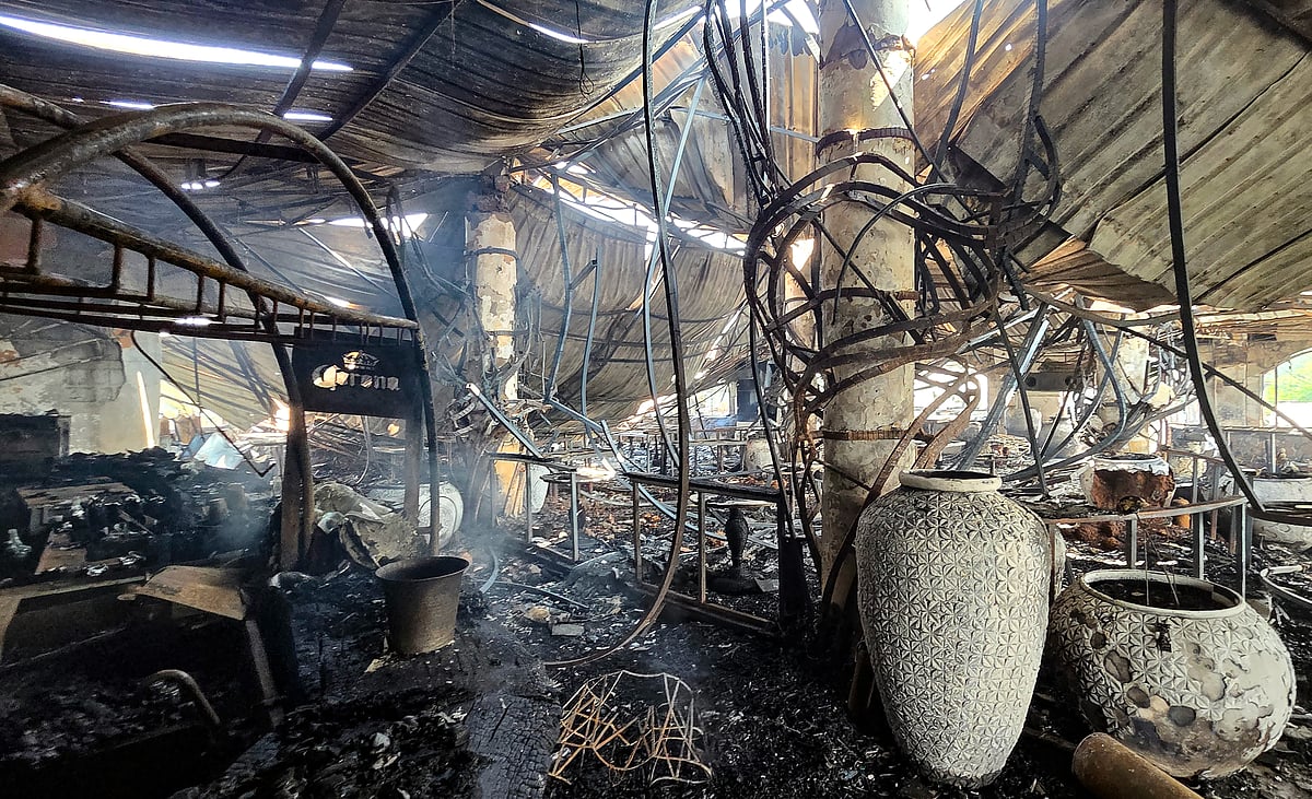 The charred interior of Romeo Lane restaurant and nightclub after a fire, triggered by a cylinder blast, destroyed everything inside at Arpora in North Goa district on Sunday, December 7, 2025.