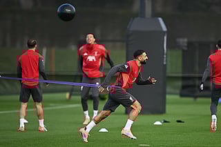 Liverpool's Egyptian striker Mohamed Salah (centre) attends a team training session at their training ground in Kirkby, Liverpool, north-west England on December 8, 2025, on the eve of their UEFA Champions League, league phase football match against Inter Milan in Milan.