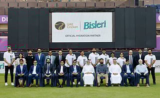 Players, men’s and women’s teams head coaches and dignitaries from the ECB and Bisleri pose at the Dubai International Stadium.