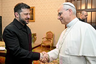 This photo taken and handout on December 9, 2025 by The Vatican Media shows Pope Leo XIV during a meeting with Ukraine's President Volodymyr Zelensky, in Castel Gandolfo.