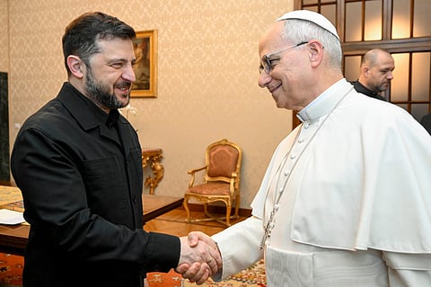This photo taken and handout on December 9, 2025 by The Vatican Media shows Pope Leo XIV during a meeting with Ukraine's President Volodymyr Zelensky, in Castel Gandolfo.