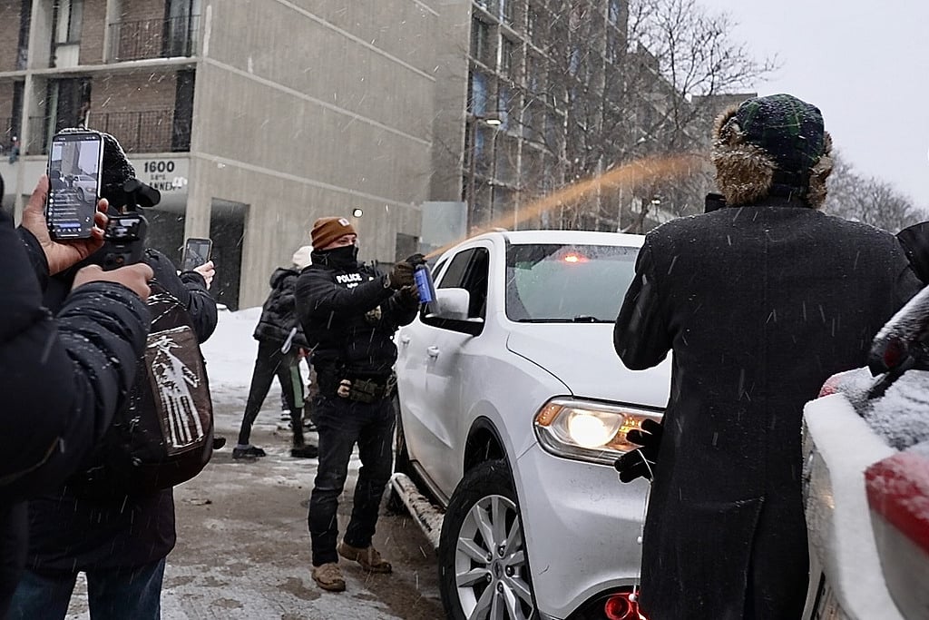 Activists confronted a group of Immigration and Customs Enforcement officers in the largely Somali neighborhood of Cedar-Riverside in Minneapolis, Tuesday, Dec. 9, 2025.