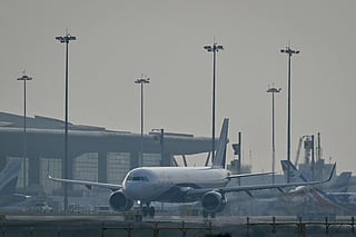 An IndiGo Airlines aircraft prepares to take off at Kempegowda International Airport on a hazy day in Bengaluru on December 9, 2025.