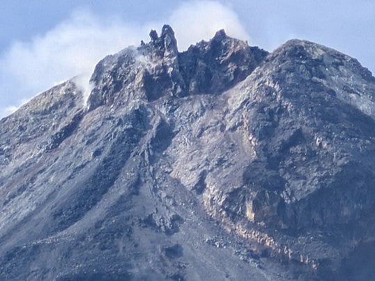 Close-up photograph of the Mayon Volcano summit reveal new spines of dark lava.