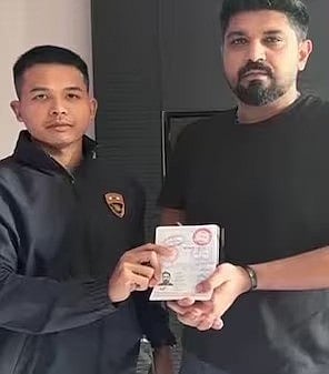  Gaurav Luthra with his suspended passport after he was arrested in Thailand.