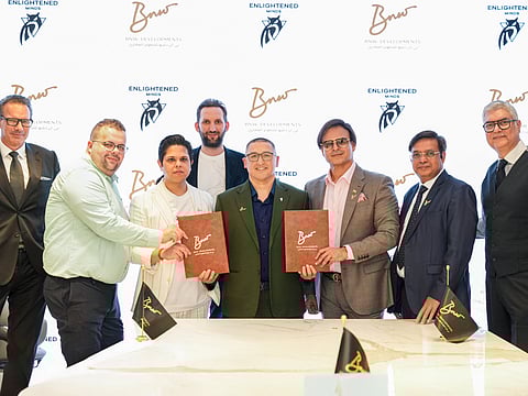Ankur Aggarwal, Chairman and Founder of BNW Developments; Timur Kudratov, Co-founder of Enlightened Minds Investments; and Vivek Anand Oberoi, Managing Director and Co-founder of BNW Developments, with their teams at the signing ceremony