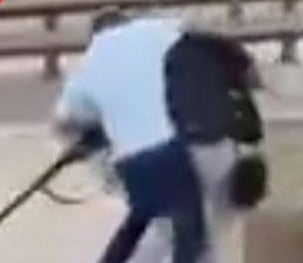 A screengrab shows Ahmed Al Ahmed tackling one of the Bondi beach attackers.
