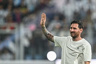 Argentina's footballer Lionel Messi greets fans during his GOAT Tour at the Wankhede Stadium in Mumbai on December 14, 2025.