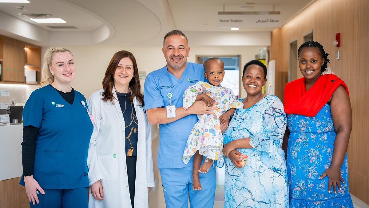 Dr Dalia Belsha (second left), Consultant Paediatric Gastroenterologist, and Dr Ahmad Alsweed (centre), Consultant Paediatric Surgeon, with the patient and his family