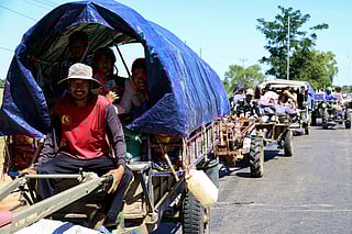 This handout photo taken and released by Agence Kampuchea Press (AKP) on December 15, 2025 shows residents evacuating following air strikes in Cambodia's Siem Reap province, amid clashes along Cambodia-Thailand border.