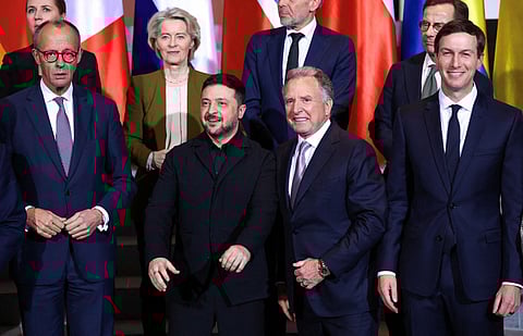 German Chancellor Friedrich Merz, Ukraine's President Volodymyr Zelensky, US special envoy Steve Witkoff, the US President's son-in-law Jared Kushner and (back row L-R) Denmark's Prime Minister Mette Frederiksen, European Commission President Ursula von der Leyen, Netherland's Prime Minister Dick Schoof and Sweden's Prime Minister Ulf Kristersson pose for a family photo on December 15, 2025 at the Chancellery in Berlin, where they meet for talks on how to end the grinding war of Russia with Ukraine.