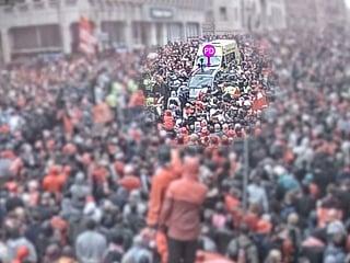 A car (c) driven by Paul Doyle - marked by police as "PD" - as crowds gather to watch an open-top bus victory parade for Liverpool's Premier League trophy parade.