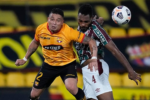 Ecuador's Barcelona Mario Pineida (L) and Brazil's Fluminense Luccas Claro vie for the ball during their Copa Libertadores quarter-finals second leg football match at the Monumental Banco Pichincha stadium in Guayaquil, Ecuador. File photo taken on August 19, 2021.