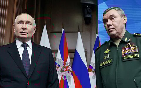 Russian President Vladimir Putin, left, and Russian Chief of General Staff Gen. Valery Gerasimov attend the annual board meeting of the country's Defense Ministry and awards soldiers in Moscow, Russia, Wednesday, Dec. 17, 2025. (Alexander Kazakov/Sputnik, Kremlin Pool Photo via AP)