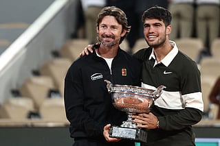 Spain's Carlos Alcaraz poses with his Spanish coach Juan Carlos Ferrero.