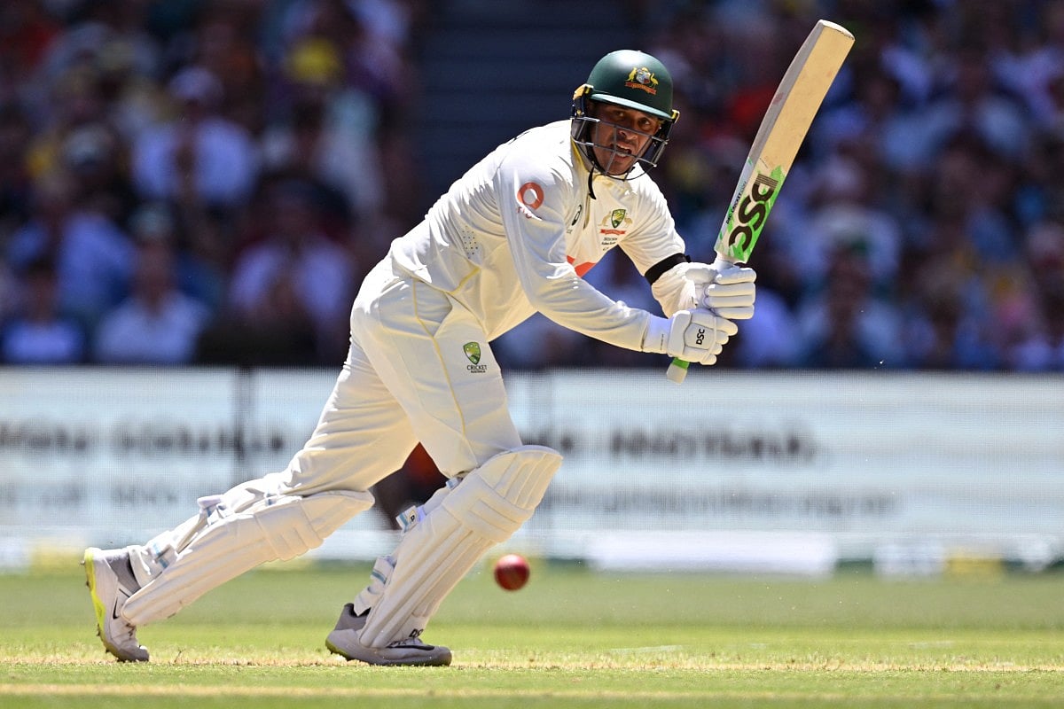 Australia's Usman Khawaja plays a shot on the first day of the third Ashes cricket Test match between Australia and England at the Adelaide Oval in Adelaide on December 17, 2025.