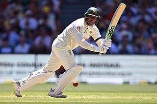 Australia's Usman Khawaja plays a shot on the first day of the third Ashes cricket Test match between Australia and England at the Adelaide Oval in Adelaide on December 17, 2025.