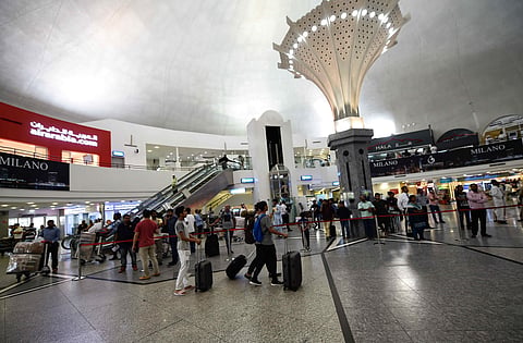 Passengers at Sharjah International Airport. UAE airports continue operating at near-normal levels despite renewed tensions in the Middle East. 