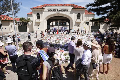 Mourners pay tribute outside Bondi Pavilion in Sydney on December 18, 2025, to honour victims of the Bondi Beach shooting.