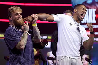 Jake Paul and Anthony Joshua face off during the press conference at The Fillmore Miami Beach on December 17, 2025 in Miami Beach, Florida.