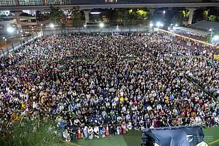 Filipino faithful at the Simbang Gabi pre-Christmas mass at St. Mary's Church on Tuesday. Nearly 30,000 people are said to have attended. 