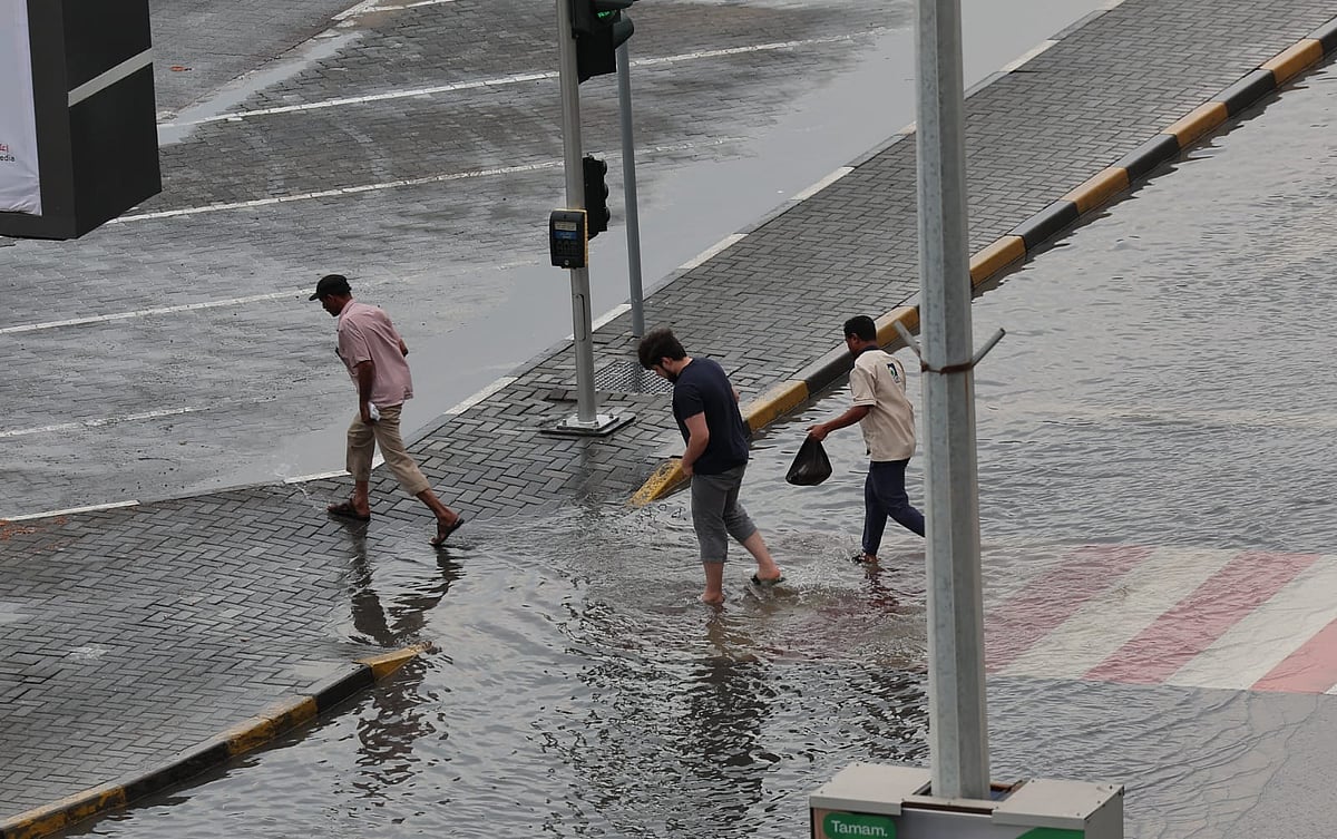 Flooded Al Majaz: Residents navigate rain