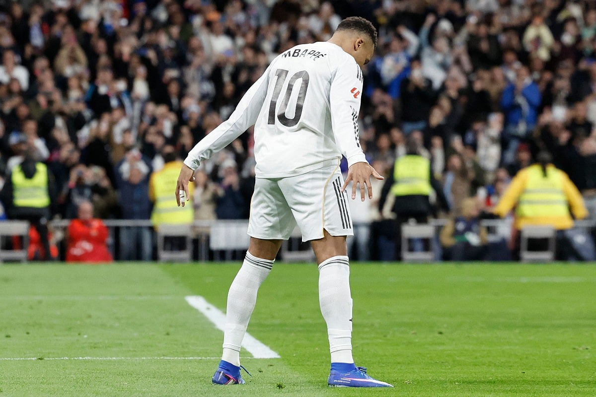 Real Madrid's French forward #10 Kylian Mbappe celebrates scoring his team's second goal during the Spanish league football match between Real Madrid CF and Sevilla FC at Santiago Bernabeu Stadium in Madrid on December 20, 2025.