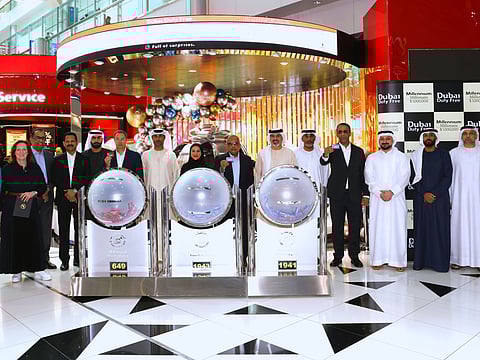 Dubai Duty Free officials announce the latest Finest Surprise draw winners.