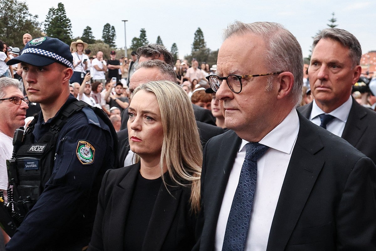 Australia's Prime Minister Anthony Albanese arrives with his wife Jodie Haydon to attend the memorial held for the victims of a shooting at Bondi Beach in Sydney on December 21, 2025.