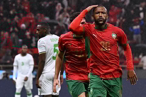 Morocco's forward #20 Ayoub El Kaabi celebrates his goal during the Africa Cup of Nations (CAN) group A football match between Morocco and Comoros at Prince Moulay Abdellah Stadium in Rabat on December 21, 2025.