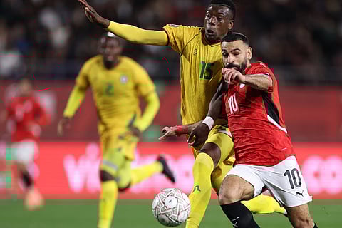 Egypt's forward #10 Mohamed Salah (2L) celebrates scoring the team's second goal during the Africa Cup of Nations (CAN) group B football match between Egypt and Zimbabwe at Adrar Stadium in Agadir on December 22, 2025.
