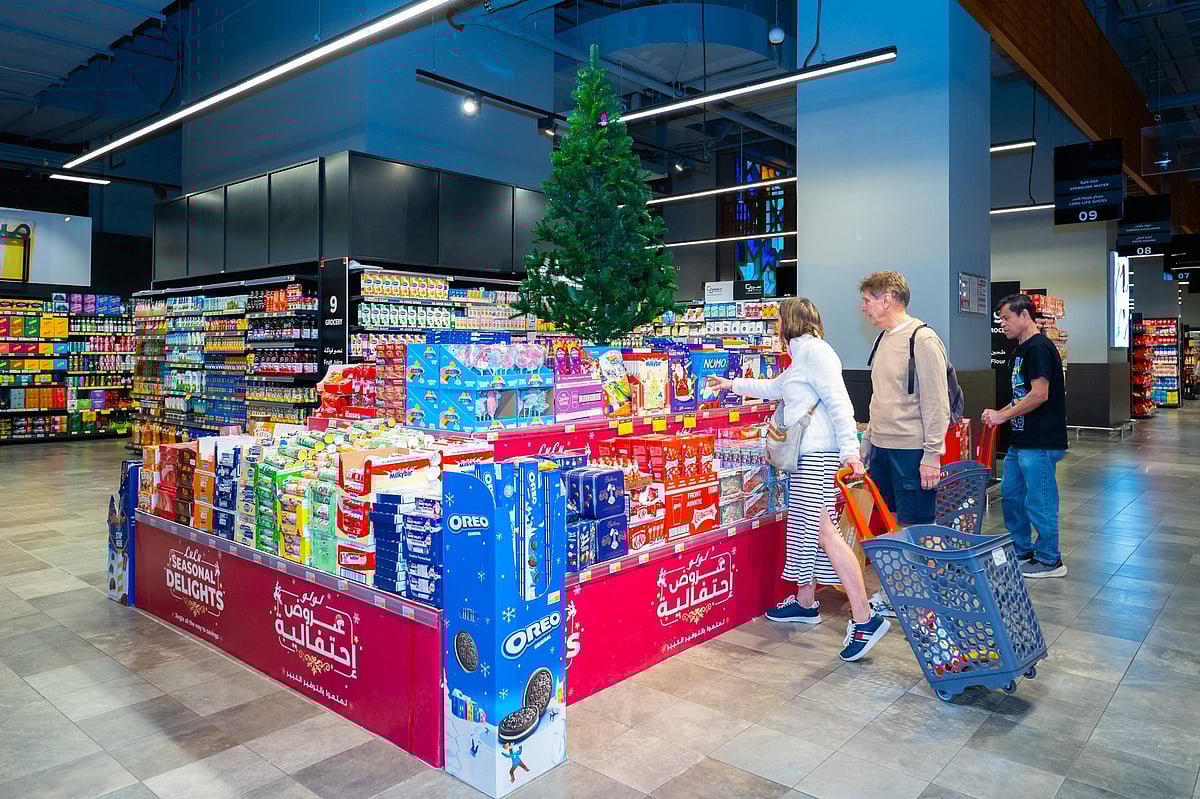 Shoppers browse festive cakes and Christmas décor at a UAE supermarket ahead of Christmas.