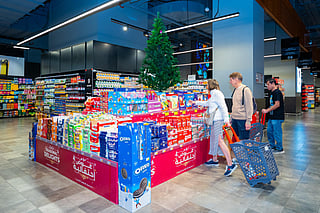 Shoppers browse festive cakes and Christmas décor at a UAE supermarket ahead of Christmas.