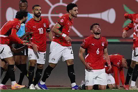 Egypt's forward #10 Mohamed Salah (2L) celebrates scoring the team's second goal during the Africa Cup of Nations (CAN) group B football match between Egypt and Zimbabwe at Adrar Stadium in Agadir on December 22, 2025.
