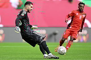 Algeria's goalkeeper Luca Zidane clears the ball past Sudan's midfielder Abdelrazig Omer during the Africa Cup of Nations (CAN) Group E football match against Sudan at Moulay Hassan Stadium in Rabat on December 24, 2025.