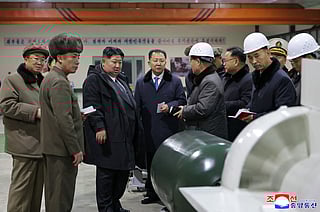 North Korean leader Kim Jong Un visits the manufacturing site of an 8,700-tonnage nuclear-powered strategic guided missile submarine at an undisclosed location in North Korea.