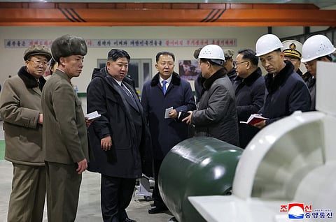 North Korean leader Kim Jong Un visits the manufacturing site of an 8,700-tonnage nuclear-powered strategic guided missile submarine at an undisclosed location in North Korea.